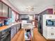 A view of kitchen with brick accents, island, and appliances offering functionality at 257 N Letterman Rd, Paragon, IN 46166