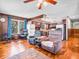 Open-concept living room featuring hardwood floors, comfortable seating, and a view to the kitchen at 257 N Letterman Rd, Paragon, IN 46166