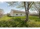 A large backyard with beautiful green grass surrounds this home, perfect for outdoor activities and relaxation at 2680 Woodfield Blvd, Franklin, IN 46131