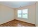 Bright bedroom featuring laminated floors, neutral walls, a window to let in natural light, and an electric outlet at 2680 Woodfield Blvd, Franklin, IN 46131