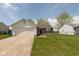 Charming single-Gathering home with a well-maintained front lawn and attached garage at 2680 Woodfield Blvd, Franklin, IN 46131