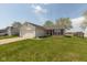 Well-maintained single-Gathering home with attached garage and green lawn at 2680 Woodfield Blvd, Franklin, IN 46131