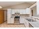 Stylish kitchen features new white cabinets, stainless steel appliances, and granite countertops at 2680 Woodfield Blvd, Franklin, IN 46131
