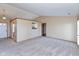Bright, spacious living room featuring neutral walls and new carpet at 2680 Woodfield Blvd, Franklin, IN 46131