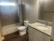 Bathroom with a shower and tub, granite vanity, and new flooring at 302 Sanders St, Indianapolis, IN 46225