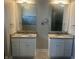 Bathroom with granite countertops, dual sinks, and modern fixtures at 302 Sanders St, Indianapolis, IN 46225
