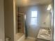 Bathroom featuring a bathtub with shower and vanity with double sinks at 302 Sanders St, Indianapolis, IN 46225