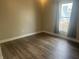 Bedroom with window and wood floors at 302 Sanders St, Indianapolis, IN 46225