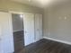 Bedroom with an open doorway and new flooring at 302 Sanders St, Indianapolis, IN 46225