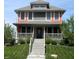 Charming two-story home with a welcoming front porch and landscaped front yard at 302 Sanders St, Indianapolis, IN 46225