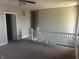 View of the upstairs hallway with neutral paint and white railings and trim at 302 Sanders St, Indianapolis, IN 46225