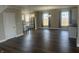 Living area with hardwood floors flowing into the adjacent kitchen at 302 Sanders St, Indianapolis, IN 46225