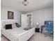 Bedroom with bright windows, neutral paint, desk, and comfortable furnishings at 3128 E Fall Creek Pkwy N Dr, Indianapolis, IN 46205