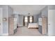 Bright bedroom features neutral walls, plush carpet, and matching dressers with ample storage at 3128 E Fall Creek Pkwy N Dr, Indianapolis, IN 46205
