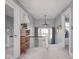 Upstairs hallway featuring a staircase, neutral paint, and bright windows at 3128 E Fall Creek Pkwy N Dr, Indianapolis, IN 46205