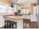 Kitchen featuring a breakfast bar, stainless steel appliances, and ample counter space at 3128 E Fall Creek Pkwy N Dr, Indianapolis, IN 46205