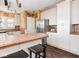 Kitchen featuring stainless steel appliances, an island counter, and white cabinetry at 3128 E Fall Creek Pkwy N Dr, Indianapolis, IN 46205