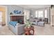 Bright living room with a brick fireplace and picture window, providing a comfortable and inviting space at 3128 E Fall Creek Pkwy N Dr, Indianapolis, IN 46205