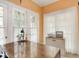 Office space with french doors, natural light, and a vintage desk at 3128 E Fall Creek Pkwy N Dr, Indianapolis, IN 46205