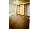 A vacant bedroom with stained carpet, large closet and a window with blinds at 3136 Foltz St, Indianapolis, IN 46221