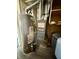 Mechanical room with Goodman furnace, Richmond hot water heater, and dark wood floor at 3136 Foltz St, Indianapolis, IN 46221