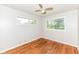 Cozy bedroom with natural light, hardwood floors, and a ceiling fan at 319 E Ohio St, Fortville, IN 46040