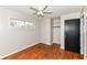 Cozy bedroom with ceiling fan, hardwood floors, closet and a window allowing for plenty of natural light at 319 E Ohio St, Fortville, IN 46040