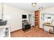 Well-lit kitchen with modern appliances, wooden shelf, and sleek countertops at 319 E Ohio St, Fortville, IN 46040