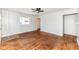 Spacious living room featuring hardwood floors and a ceiling fan at 319 E Ohio St, Fortville, IN 46040