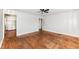Open living room featuring hardwood floors, a ceiling fan, and light-colored walls at 319 E Ohio St, Fortville, IN 46040