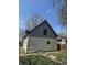 Outside image of the back of the house that features a door and some grass at 325 Harlan St, Indianapolis, IN 46201