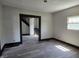 Spacious living room with stairs and gray flooring at 325 Harlan St, Indianapolis, IN 46201