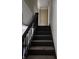 Stairway to upper floor at 325 Harlan St, Indianapolis, IN 46201
