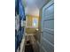 A well-lit bathroom featuring wood floors, a modern vanity, and a decorative shower curtain at 3601 N Kenwood Ave, Indianapolis, IN 46208