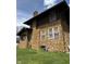 Charming stone-clad home featuring a well-maintained lawn at 3601 N Kenwood Ave, Indianapolis, IN 46208