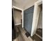 A wide hallway leads to other rooms with storage and dark wood floors at 3601 N Kenwood Ave, Indianapolis, IN 46208