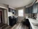 Functional kitchen with dark cabinets, modern countertops, and updated appliances at 3601 N Kenwood Ave, Indianapolis, IN 46208