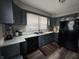This kitchen offers ample cabinet space, a large window, and modern appliances at 3601 N Kenwood Ave, Indianapolis, IN 46208