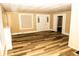 Bright living room featuring modern flooring, a neutral color palette, and lots of natural light at 3601 N Kenwood Ave, Indianapolis, IN 46208