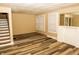 Inviting living room showcasing modern flooring, a neutral color scheme, and a decorative fireplace at 3601 N Kenwood Ave, Indianapolis, IN 46208