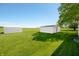 Spacious backyard with two sheds, offering ample storage and functionality at 403 N Red Gold Dr, Trafalgar, IN 46181