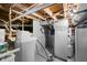 Unfinished basement featuring utilities, painted floor, and painted walls at 403 N Red Gold Dr, Trafalgar, IN 46181