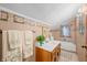 Bathroom with a single vanity and a bath and shower combo at 403 N Red Gold Dr, Trafalgar, IN 46181