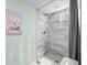 Bathroom features a modern walk-in shower with decorative tile and glass door at 403 N Red Gold Dr, Trafalgar, IN 46181
