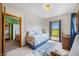 Comfortable bedroom with large windows that offer a view of the landscape at 403 N Red Gold Dr, Trafalgar, IN 46181