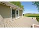 Deck featuring sliding glass doors with views of spacious backyard with mature trees at 403 N Red Gold Dr, Trafalgar, IN 46181