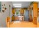 Open dining area showcasing wooden cabinetry and views of a well-equipped kitchen at 403 N Red Gold Dr, Trafalgar, IN 46181