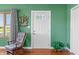 Entryway with a decorative front door and wood rocking chair showcasing charm and character at 403 N Red Gold Dr, Trafalgar, IN 46181