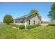Well-maintained home with verdant landscaping and a serene outdoor space at 403 N Red Gold Dr, Trafalgar, IN 46181