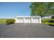 Detached garage with three bays offers ample parking and storage space at 403 N Red Gold Dr, Trafalgar, IN 46181